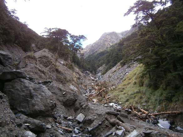 Looking upriver towards Zhongyangjian Shan, the river obstructed by landslides.