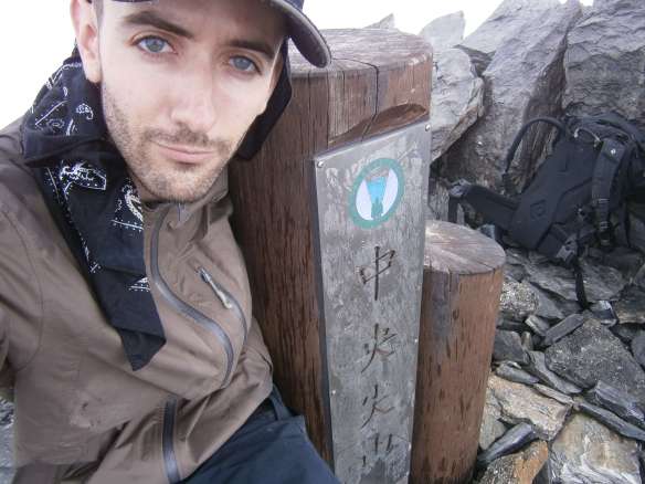 Feeling accomplishment, despite the clouds and lack of view.