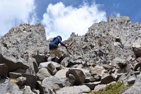 Climbing up the rock and talus on Cloudripper.