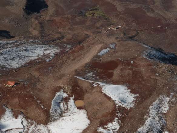The workers' hut and my campsite are top right, near the cars.  The two refuges are center and left.