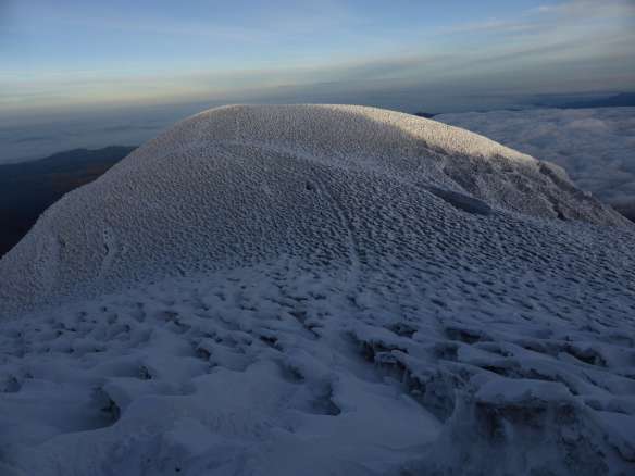The penitente-covered plateau between the Veintimilla and Whymper summits.