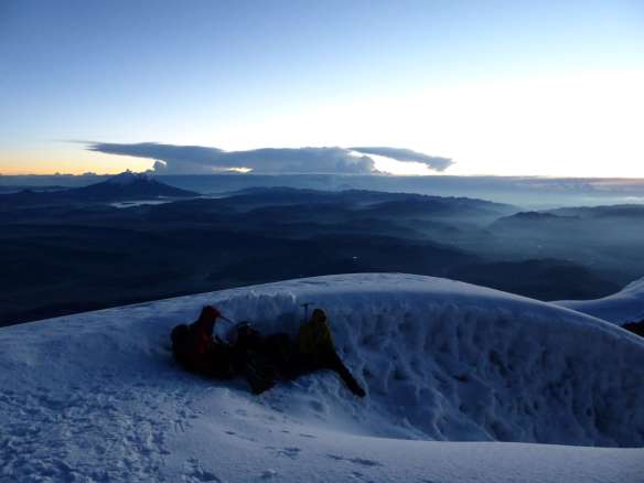 The Belgian team taking shelter from the wind.