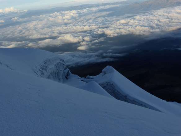 Descending from the summit, a sea of clouds below us.