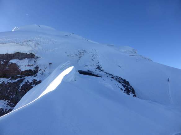 The top and crux of the route.  This image provides a good sense of scale to the sheer size of Cotopaxi.  Yanasacha is at center left.  Zoom into this photo to see the Belgian team of four descending, and four other teams still ascending.